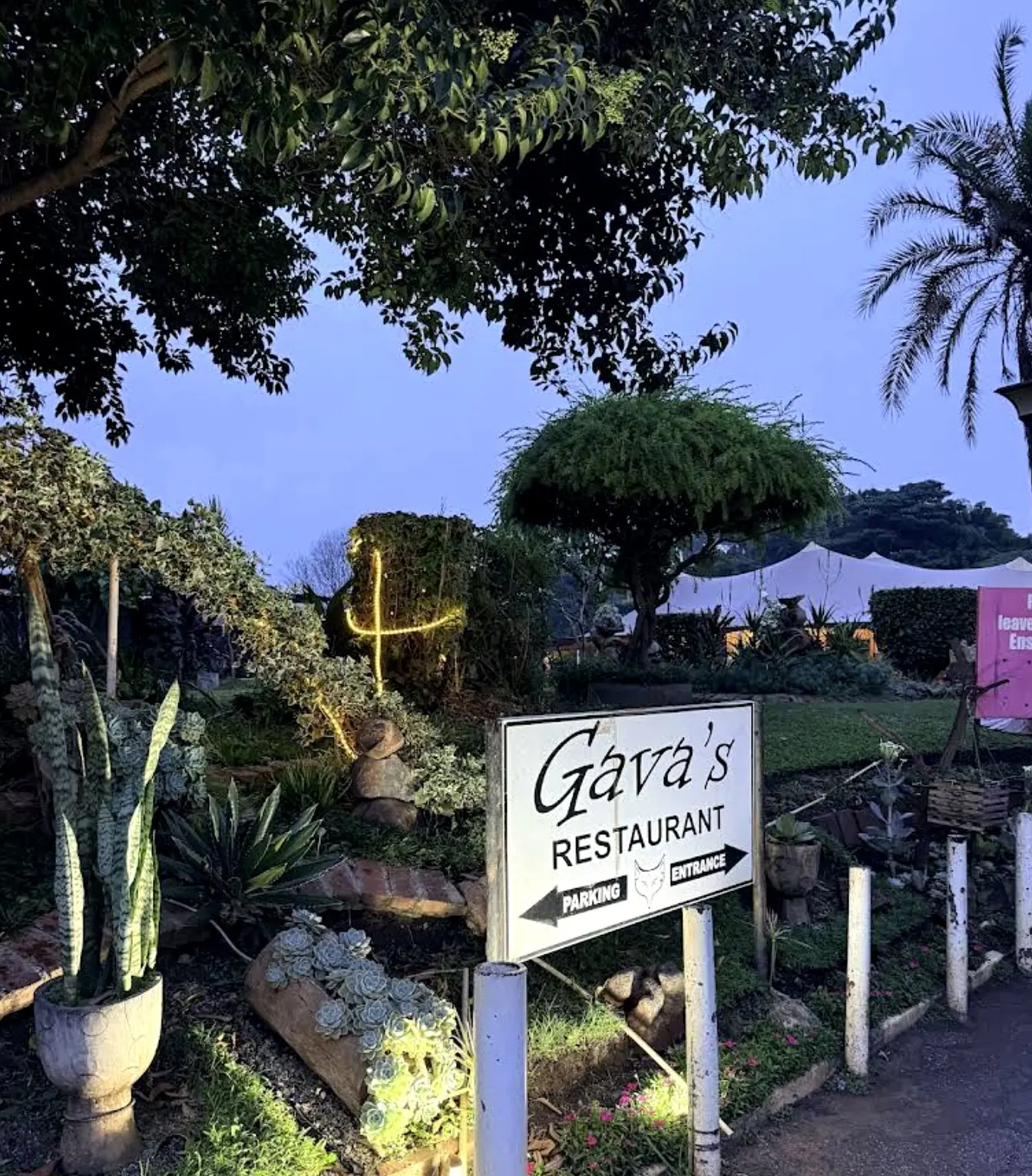 Gava's Restaurant entrance sign in the garden